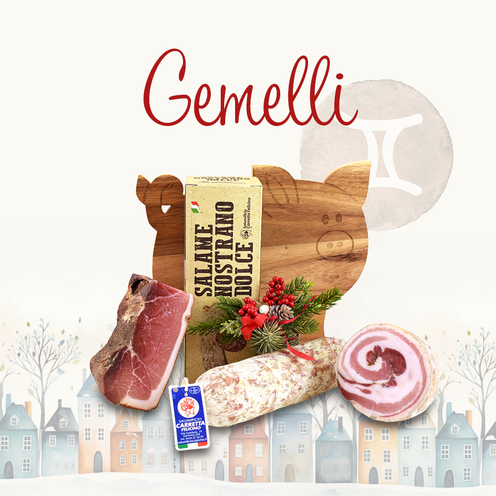 Cesto natalizio contenente prodotti alimentari in una confezione decorata e la scritta "Gemelli"