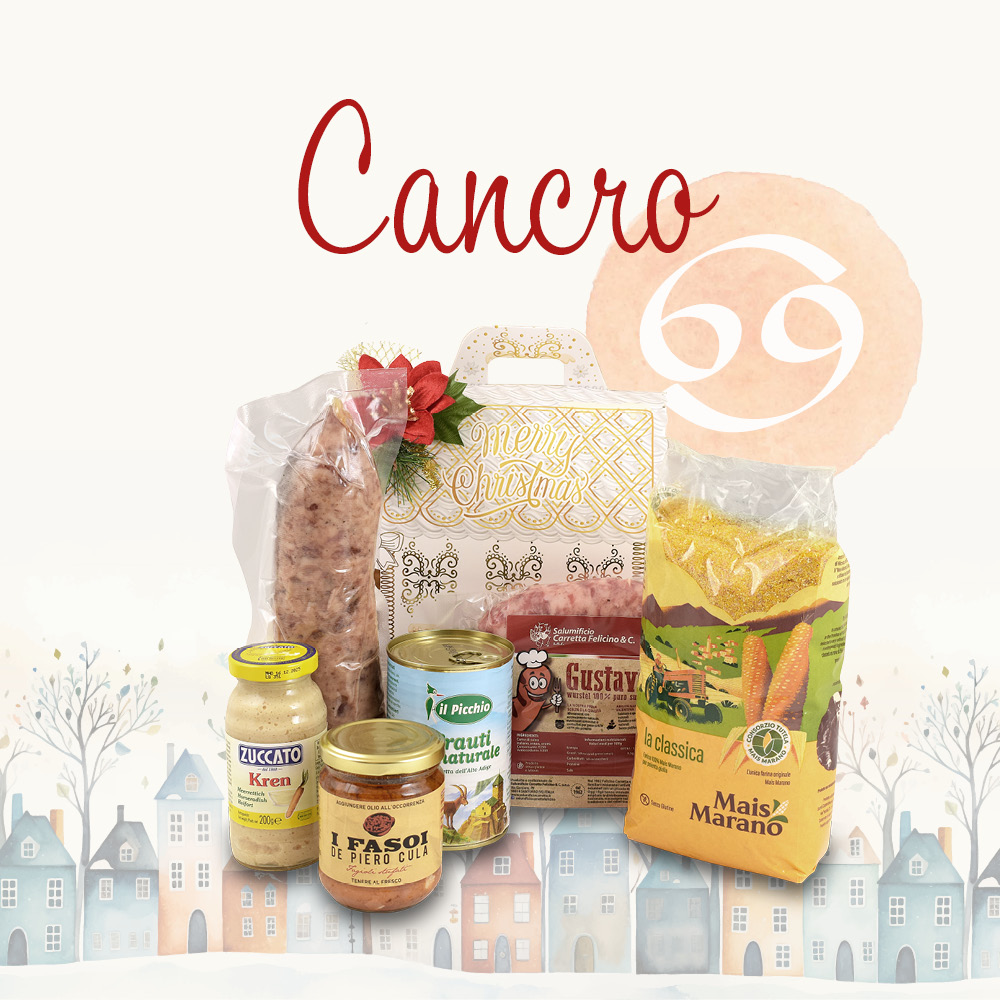 Cesto natalizio contenente prodotti alimentari in una confezione decorata e la scritta "Cancro"