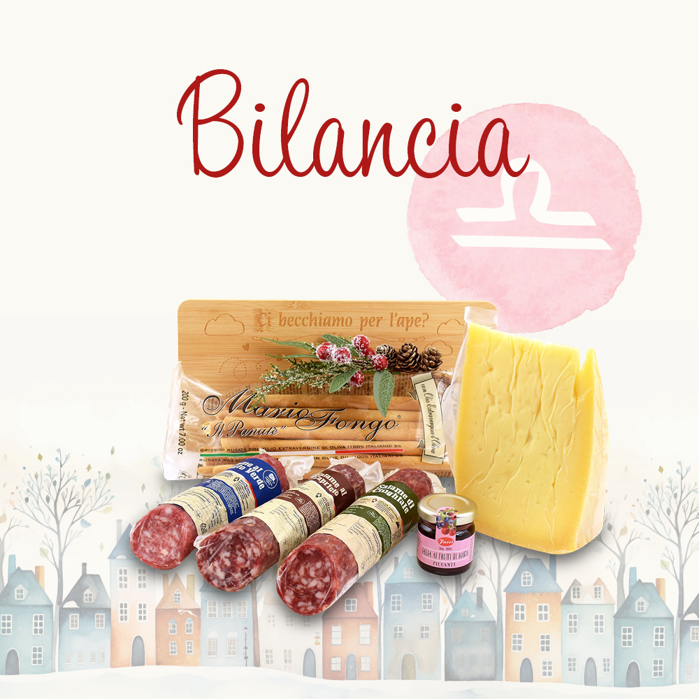 Cesto natalizio contenente prodotti alimentari in una confezione decorata e la scritta "Bilancia"
